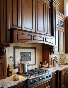 A remodeled kitchen with traditional wood hood