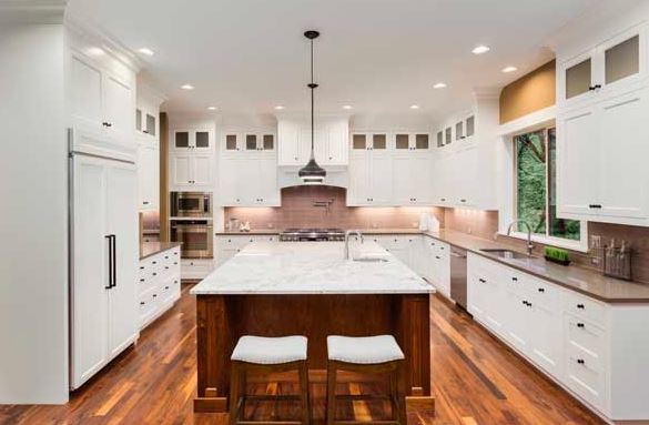 In U-shaped kitchen design there are three walls of continuous countertops and appliances