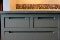 Kitchen cabinets with cust outs instead of hardware
