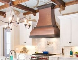 Remodeled kitchen with copper chimney hood