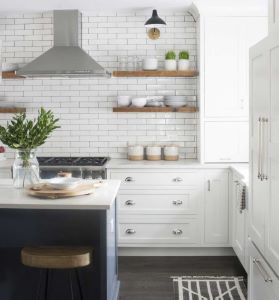 open shelves near the stove keep important items handy in the gourmet kitchen