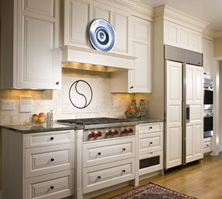 This remodeled kitchen features a box style mantel hood