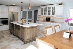 The island in a Transitional kitchen design is a good place to use rustic wood