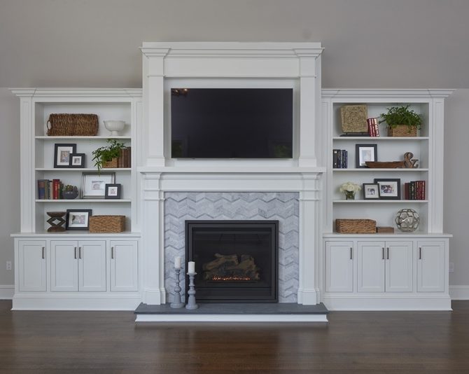 Custom cabinets create a beautiful fireplace surround