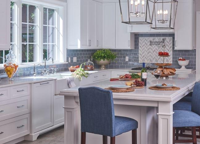 Transitional kitchen includes Subway tiles and white painted cabinets with flat panels 