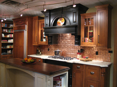 Mantel hood is finished in a different color than the cabinets