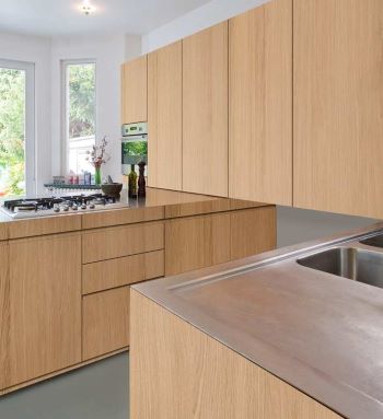 A new contemporary kitchen with sequential matched veneer doors