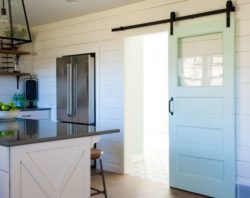 Sliding barn doors are useful for saving space in a small kitchen