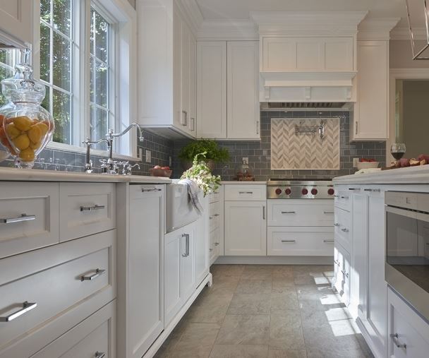 white painted cabinets are an important part of a modern farmhouse kitchen